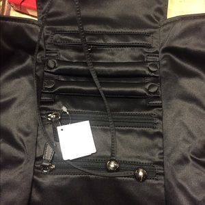 Coach jewelry holder.